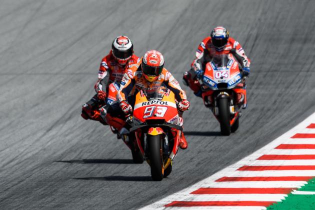 Repsol Honda Team's Spanish rider Marc Marquez (C), Ducati Team's Spanish rider Jorge Lorenzo (L) and Ducati Team's Italian rider Andrea Dovizioso compete during the Austrian MotoGP Grand Prix race at the Red Bull Ring in Spielberg, Austria on August 12, 2018. (Photo by Jure Makovec / AFP)        (Photo credit should read JURE MAKOVEC/AFP/Getty Images)