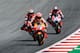 Repsol Honda Team's Spanish rider Marc Marquez (C), Ducati Team's Spanish rider Jorge Lorenzo (L) and Ducati Team's Italian rider Andrea Dovizioso compete during the Austrian MotoGP Grand Prix race at the Red Bull Ring in Spielberg, Austria on August 12, 2018. (Photo by Jure Makovec / AFP) (Photo credit should read JURE MAKOVEC/AFP/Getty Images)