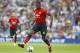 Manchester United's Paul Pogba runs with the ball during the English Premier League soccer match between Brighton and Hove Albion and Manchester United at the Amex stadium in Brighton, England, Sunday, Aug.19, 2018. (AP Photo/Alastair Grant)
