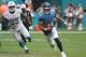 MIAMI, FL - SEPTEMBER 09: Quarterback Marcus Mariota #8 of the Tennessee Titans scrambles against William Hayes #95 of the Miami Dolphins at Hard Rock Stadium on September 9, 2018 in Miami, Florida. (Photo by Marc Serota/Getty Images)