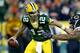 Sports GREEN BAY, WI - SEPTEMBER 09: Aaron Rodgers #12 of the Green Bay Packers avoids being sacked by Akiem Hicks #96 of the Chicago Bears during the first quarter of a game at Lambeau Field on September 9, 2018 in Green Bay, Wisconsin. (Photo by Dylan Buell/Getty Images)
