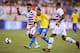 Brazil's foward Neymar (R) vies for the ball against US midfielder Weston McKennie and defender DeAndre Yedlin during the international friendly match between Brazil and the US at the Metlife Stadium in East Rutherford, New Jersey on September 7, 2018. (Photo by EDUARDO MUNOZ ALVAREZ / AFP) (Photo credit should read EDUARDO MUNOZ ALVAREZ/AFP/Getty Images)