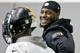 Pittsburgh Steelers running back Le'Veon Bell (26), right, smiles while talking to running back Fitzgerald Toussaint (33) as he participates in an NFL football practice, Thursday, Jan. 11, 2018, in Pittsburgh. The Steelers host the Jacksonville Jaguars in a divisional playoff on Sunday. (AP Photo/Keith Srakocic)