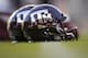 Texas A&M reflective helmets sit on the field before the start of a NCAA college football against Mississippi State on Saturday, Oct. 28, 2017, in College Station, Texas. (AP Photo/Sam Craft)