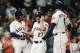 HOUSTON, TX - SEPTEMBER 05: Jose Altuve #27 of the Houston Astros celebrates with Tony Kemp #18 and George Springer #4 after all three scored on a double by Alex Bregman #2 in the eighth inning against the Minnesota Twins at Minute Maid Park on September 5, 2018 in Houston, Texas. (Photo by Bob Levey/Getty Images)