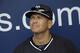 FILE - In this Feb. 26, 2015, file photo, New York Yankees' Alex Rodriguez sits in the dugout during a spring training baseball workout in Tampa, Fla. Rodriguez is back on the field for the New York Yankees in his new role as an instructor. A-Rod arrived Friday, Sept. 30, 2016, at the Yankees' minor league complex in Tampa, to work with prospects taking part in instructional league. (AP Photo/Lynne Sladky, File)