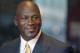 FILE - In this Aug. 21, 2015, file photo, former NBA star and current owner of the Charlotte Hornets, Michael Jordan, smiles at reporters in Chicago. Jordan announced Monday, July 25, 2016, he’s giving $1 million to the Institute for Community-Police Relations and $1 million to the NAACP Legal Defense Fund to help build trust between blacks and law enforcement following several disturbing clashes around the country. (AP Photo/Charles Rex Arbogast, File)