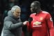 Manchester United's Portuguese manager Jose Mourinho (L) talks with Manchester United's Belgian striker Romelu Lukaku (R) during half-times during the English Premier League football match between Manchester United and Manchester City at Old Trafford in Manchester, north west England, on December 10, 2017. / AFP PHOTO / Oli SCARFF / RESTRICTED TO EDITORIAL USE. No use with unauthorized audio, video, data, fixture lists, club/league logos or 'live' services. Online in-match use limited to 75 images, no video emulation. No use in betting, games or single club/league/player publications. / (Photo credit should read OLI SCARFF/AFP/Getty Images)