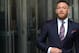 Irish mixed martial arts superstar Conor McGregor arrives to talk to the press after he pleaded guilty to a single violation of disorderly conduct, in Brooklyn Criminal Court on July 26, 2018. - The 30-year-old, who is nicknamed 'The Notorious,' had been charged with multiple counts of assault and criminal mischief after attacking a bus filled with UFC fighters at the Barclays Center. He pleaded guilty to a lesser charge of disorderly conduct in a fleeting court appearance, and was handed a punishment of five days' community service. (Photo by TIMOTHY A. CLARY / AFP) (Photo credit should read TIMOTHY A. CLARY/AFP/Getty Images)