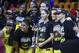 Seattle Storm guard Sue Bird, holding trophy, and other pose with the trophy after Game 3 of the WNBA basketball finals against the Washington Mystics, Wednesday, Sept. 12, 2018, in Fairfax, Va. The Storm won 98-82.(AP Photo/Nick Wass)