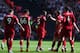 LONDON, ENGLAND - SEPTEMBER 15: Georginio Wijnaldum of Liverpool celebrates with teammates after scoring his team's first goal during the Premier League match between Tottenham Hotspur and Liverpool FC at Wembley Stadium on September 15, 2018 in London, United Kingdom. (Photo by Clive Rose/Getty Images)