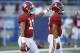 ORLANDO, FL - SEPTEMBER 01: Tua Tagovailoa #13 of the Alabama Crimson Tide pats the helmet of teammate Jalen Hurts #2 prior to a game against the Louisville Cardinals at Camping World Stadium on September 1, 2018 in Orlando, Florida. Alabama won 51-14. (Photo by Joe Robbins/Getty Images)