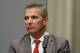 Ohio State University football coach Urban Meyer is seen during a press conference in Columbus, Ohio, Wednesday, Aug. 22, 2018, to announce the results of an investigation of NCAA college football coach Urban Meyer for the way he handled domestic-abuse allegations against a former assistant. Ohio State suspended Meyer on Wednesday for three games for mishandling domestic violence accusations, punishing one of the sport's most prominent leaders for keeping an assistant on staff for several years after the coach's wife accused him of abuse. (AP Photo/Paul Vernon)