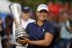 Angela Stanford of the U.S. poses with her trophy trophy after winning the Evian Championship women's golf tournament in Evian, eastern France, Sunday, Sept. 16, 2018. (AP Photo/Francois Mori)