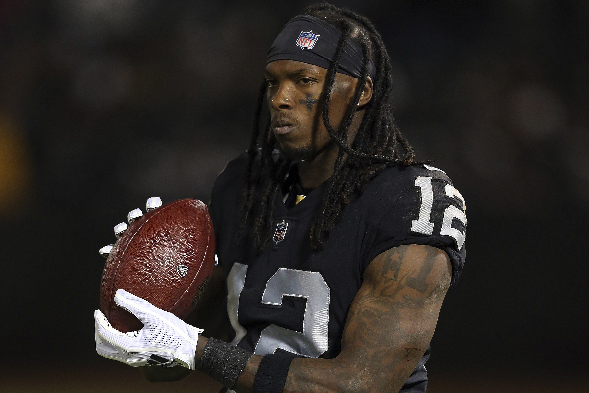 Oakland Raiders wide receiver Martavis Bryant (12) tries to break