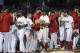 Boston Red Sox players celebrate their 4-3 victory over the Toronto Blue Jays in a baseball game at Fenway Park, Thursday, Sept. 13, 2018, in Boston. (AP Photo/Elise Amendola)