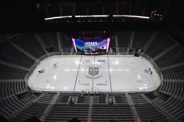 Workmen prepare the T-Mobile Arena ice before the start of an NHL hockey game between the Vegas Golden Knights and the Edmonton Oilers Thursday, Feb. 15, 2018, in Las Vegas. (AP Photo/David Becker)