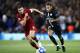 LIVERPOOL, ENGLAND - SEPTEMBER 18: Neymar of Paris Saint-Germain runs with the ball under pressure from Jordan Henderson of Liverpool during the Group C match of the UEFA Champions League between Liverpool and Paris Saint-Germain at Anfield on September 18, 2018 in Liverpool, United Kingdom. (Photo by Julian Finney/Getty Images)