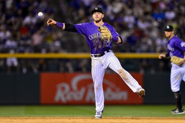 DENVER, CO - AUGUST 10: Trevor Story #27 of the Colorado Rockies sets to throw out a runner against the Los Angeles Dodgers  at Coors Field on August 10, 2018 in Denver, Colorado.  (Photo by Dustin Bradford/Getty Images)