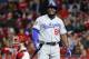 Los Angeles Dodgers' Yasiel Puig reacts after a strike against Cincinnati Reds relief pitcher Jared Hughes in the seventh inning of a baseball game, Monday, Sept. 10, 2018, in Cincinnati. (AP Photo/John Minchillo)