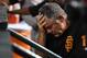 PHOENIX, AZ - AUGUST 05: Manager Bruce Bochy #15 of the San Francisco Giants rests his head in his hand while sitting in the dugout during the third inning of a game against the Arizona Diamondbacks at Chase Field on August 5, 2018 in Phoenix, Arizona. (Photo by Norm Hall/Getty Images)