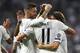 Real Madrid's Welsh forward Gareth Bale (C) celebrates scoring his team's second goal with teammates during the UEFA Champions League group G football match between Real Madrid CF and AS Roma at the Santiago Bernabeu stadium in Madrid on September 19, 2018. (Photo by GABRIEL BOUYS / AFP) (Photo credit should read GABRIEL BOUYS/AFP/Getty Images)