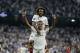 Real forward Mariano Diaz, down, celebrates with defender Marcelo after scoring his side's third goal during a Group G Champions League soccer match between Real Madrid and Roma at the Santiago Bernabeu stadium in Madrid, Spain, Wednesday Sept. 19, 2018. (AP Photo/Manu Fernandez)