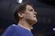 Dallas Mavericks owner Mark Cuban walks off the court after the first half of an NBA basketball game against the Memphis Grizzlies, Wednesday, April 12, 2017, in Memphis, Tenn. (AP Photo/Brandon Dill)