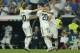 Real midfielder Marco Asensio, center, celebrates with Luka Modric, left, and Dani Ceballos after scoring his side's first goal during a La Liga soccer match between Real Madrid and Espanyol at the Santiago Bernabeu stadium in Madrid, Spain, Saturday, Sept. 22, 2018. (AP Photo/Paul White)
