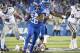 Kentucky running back Benny Snell Jr. (26) avoids the tackle of several Mississippi State and runs for a touchdown during the second half of an NCAA college football game in Lexington, Ky., Saturday, Sept. 22, 2018. (AP Photo/Bryan Woolston)