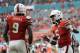 Miami quarterback N'Kosi Perry (5) celebrates with tight end Brevin Jordan (9) after Jordan scored a touchdown during the first half of an NCAA college football game against FIU, Saturday, Sept. 22, 2018, in Miami Gardens, Fla. (AP Photo/Lynne Sladky)