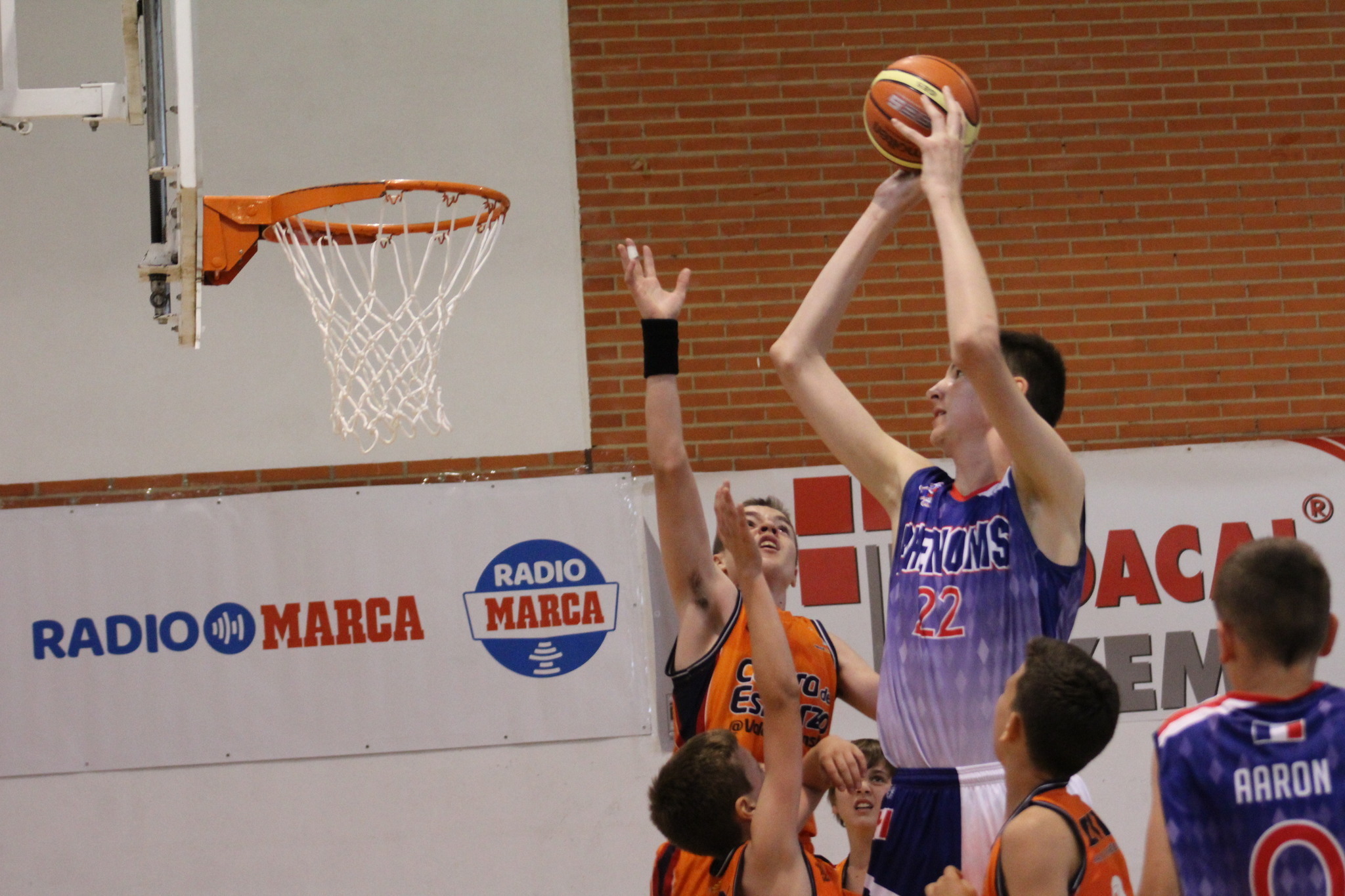 12 Year Old 7 Footer Towers Over Opponents And Shows No Mercy On