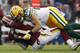 Green Bay Packers linebacker Clay Matthews (52) hits Washington Redskins quarterback Alex Smith (11) during the second half of an NFL football game, Sunday, Sept. 23, 2018 in Landover, Md. (AP Photo/Alex Brandon)
