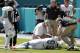 Miami Dolphins defensive end William Hayes (95) is helped on the field after a play during the first half of an NFL football game against the Oakland Raiders, Sunday, Sept. 23, 2018 in Miami Gardens, Fla. (AP Photo/Lynne Sladky)