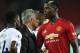 On August 27, French Manchester United coach Jose Mourinho (C) welcomes Manchester United French midfielder Paul Pogba (R) after the English whistle between Manchester United and Tottenham Hotspur at Old Trafford 2018. (Photo by Oli SCARFF / AFP) / RESTREINT FOR EDITORIAL USE. No use with unauthorized audio, video, data, device listings, club / league logos or "live" services. Online online use limited to 120 images. 40 additional images can be used in the extra time. No video emulation. Use of online social media limited to 120 images. 40 additional images can be used in the extra time. No use in publications on bets, games or publications of individual clubs / leagues / players. / (Photo credit should read OLI SCARFF / AFP / Getty Images)