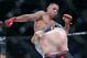 Aaron Pico, top, kicks Lee Morrison in a featherweight mixed martial arts fight at Bellator 199 in San Jose, Calif., Saturday, May 12, 2018. Pico won the fight. (AP Photo/Jeff Chiu)