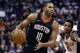 Houston Rockets guard Eric Gordon (10) looks to pass against the Phoenix Suns during the first half of an NBA basketball game, Friday, Jan. 12, 2018, in Phoenix. (AP Photo/Matt York)