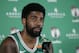 Boston Celtics guard Kyrie Irving faces reporters at NBA basketball media day, Monday, Sept. 24, 2018, in Canton, Mass. (AP Photo/Steven Senne)