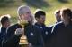 US team captain Jim Furyk holds the trophy as he takes part in a team photograph ahead of the 42nd Ryder Cup at Le Golf National Course at Saint-Quentin-en-Yvelines, south-west of Paris on September 26, 2018. (Photo by FRANCK FIFE / AFP) (Photo credit should read FRANCK FIFE/AFP/Getty Images)