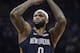FILE - In this Jan. 10, 2018 file photo New Orleans Pelicans center DeMarcus Cousins (0) shoots a free throw in the first half of an NBA basketball game against the Memphis Grizzlies in Memphis, Tenn. Cousins will be ready to play at some point this season. And when he is, the two-time defending NBA champions will be waiting. Adding a fifth All-Star to their already glitzy lineup, the Golden State Warriors have come to terms with Cousins on a one-year, $5.3 million deal _ not the biggest money move on Day 2 of the NBA Free Agency period, but the most intriguing. (AP Photo/Brandon Dill, file)