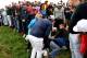 US golfer Brooks Koepka (C) reacts next to an injured spectator who fell during the fourball match on the first day of the 42nd Ryder Cup at Le Golf National Course at Saint-Quentin-en-Yvelines, south-west of Paris on September 28, 2018. (Photo by FRANCK FIFE / AFP) (Photo credit should read FRANCK FIFE/AFP/Getty Images)