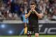 Marseille's French forward Florian Thauvin kisses his club's logo on his jersey as he celebrates after scoring a goal during the French L1 football match between Lyon (OL) and Marseille (OM) on September 23, 2018 at the Groupama stadium in Décines-Charpieu near Lyon. (Photo by ROMAIN LAFABREGUE / AFP) (Photo credit should read ROMAIN LAFABREGUE/AFP/Getty Images)