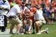 CLEMSON, SC - SEPTEMBER 29: Quarterback Trevor Lawrence #16 of the Clemson Tigers is helped from the field after taking a hard hit from the Syracuse Orange during the football game at Clemson Memorial Stadium on September 29, 2018 in Clemson, South Carolina. (Photo by Mike Comer/Getty Images)