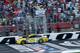 CHARLOTTE, NC - SEPTEMBER 30: Ryan Blaney, driver of the #12 Menards/Pennzoil Ford, crosses the finish line to win the Monster Energy NASCAR Cup Series Bank of America Roval 400 at Charlotte Motor Speedway on September 30, 2018 in Charlotte, North Carolina. (Photo by Brian Lawdermilk/Getty Images)