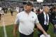 Oakland Raiders head coach Jon Gruden walks off the field after an NFL football game between the Raiders and the Cleveland Browns in Oakland, Calif., Sunday, Sept. 30, 2018. The Raiders won 45-42 in overtime. (AP Photo/D. Ross Cameron)