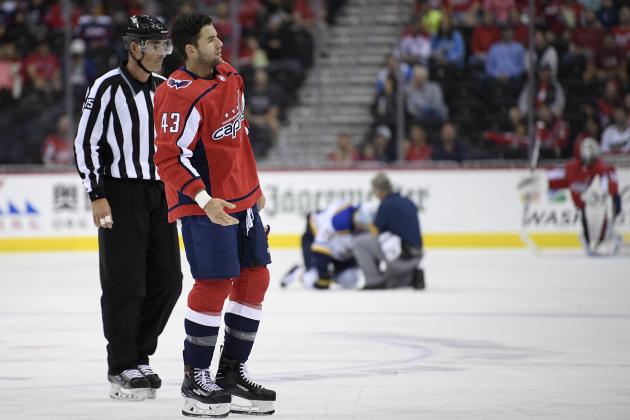 Washington Capitals right wing Tom Wilson (43) is escorted by an official off the ice after he checked St. Louis Blues center Oskar Sundqvist, on ice at back center, during the second period of an NHL preseason hockey game, Sunday, Sept. 30, 2018, in Washington. (AP Photo/Nick Wass)