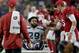 Seattle Seahawks defensive back Earl Thomas (29) is greeted by Arizona Cardinals players as he leaves the field after breaking his leg during the second half of an NFL football game, Sunday, Sept. 30, 2018, in Glendale, Ariz. The Seahawks won 20-17. (AP Photo/Ross D. Franklin)
