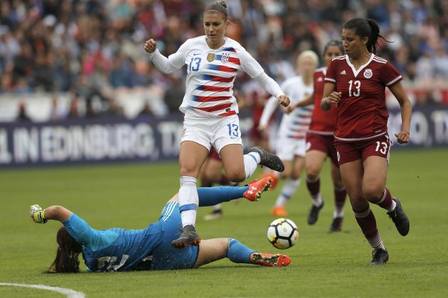 HOUSTON, TX - APRIL 08:  Cecilia Santiago #12 of Mexico takes the ball away from Alex Morgan #13 of United States in the second half at BBVA Compass Stadium on April 8, 2018 in Houston, Texas.  (Photo by Tim Warner/Getty Images)