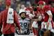 Seattle Seahawks defensive back Earl Thomas (29) is greeted by Arizona Cardinals players as he leaves the field after breaking his leg during the second half of an NFL football game, Sunday, Sept. 30, 2018, in Glendale, Ariz. The Seahawks won 20-17. (AP Photo/Ross D. Franklin)