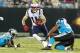 New England Patriots' Julian Edelman (11) runs as Carolina Panthers' Wes Horton (96) defends during the first half of a preseason NFL football game in Charlotte, N.C., Friday, Aug. 24, 2018. (AP Photo/Jason E. Miczek)